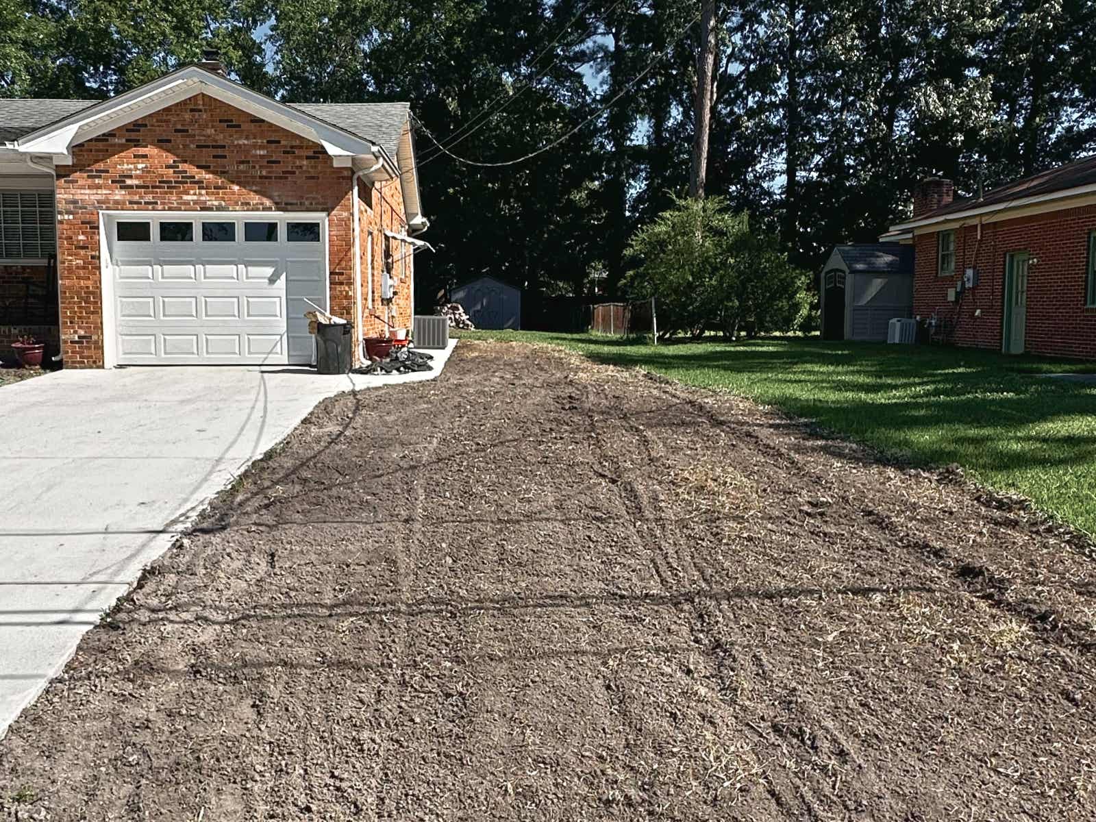 Graded side yard along the driveway